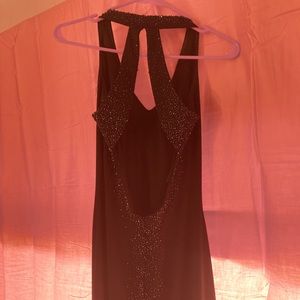 Black halter top floor length dress.